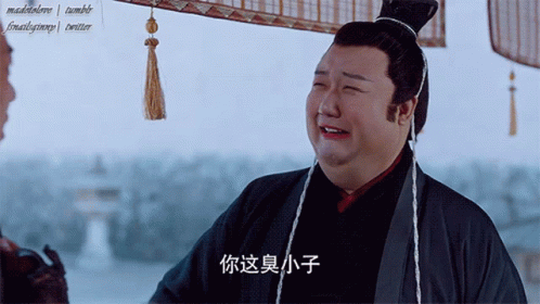 Man with Chinese Writing on Shirt