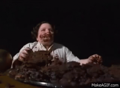 Man with Chocolate Face Eating Cake