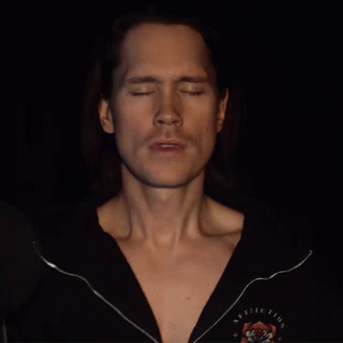 Man With Closed Eyes In Black Rolling Stones Shirt GIF