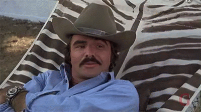 Man With Cowboy Hat and Mustache in Zebra Print Chair