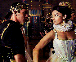 Man With Crown and Woman in White Dress