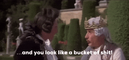 Man With Crown Talking To Man In Tuxedo GIF