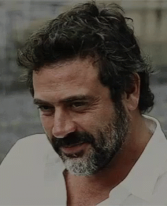 Man With Curly Hair And Beard In White Shirt GIF