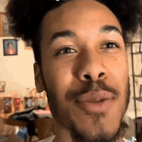 Man With Curly Hair And Beard Making Funny Face GIF