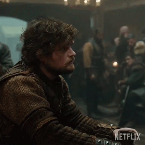 Man With Curly Hair And Beard Netflix Logo Dark Room GIF
