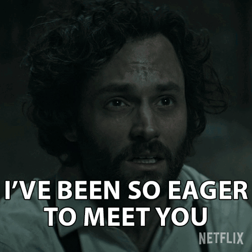 Man with Curly Hair and Beard Says Eager to Meet You