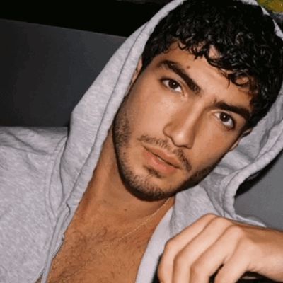 Man With Curly Hair and Beard Wearing Hoodie