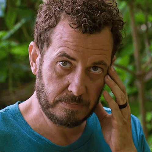 Man With Curly Hair and Beard Wearing Ring