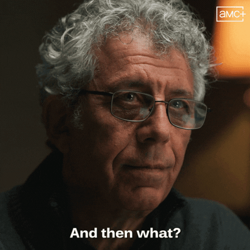 Man with Curly Hair and Glasses Asking What
