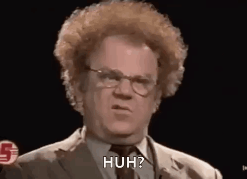 Man with Curly Hair and Glasses Saying Huh