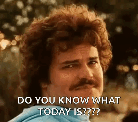 Man with Curly Hair and Mustache Asking Question