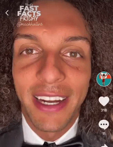 Man With Curly Hair in Suit and Bow Tie