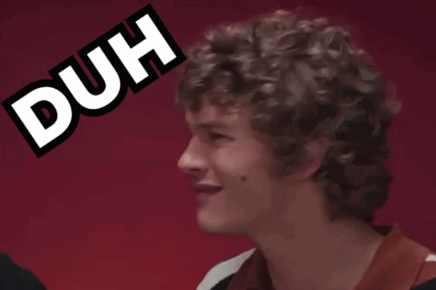Man with Curly Hair Making Duh Face