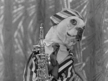 Man with Curly Hair Playing Saxophone