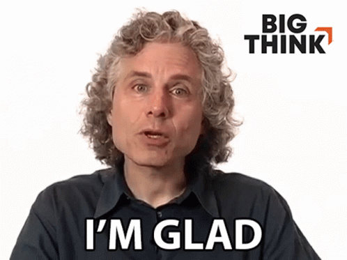 Man With Curly Hair Saying I'm Glad in Front of Big Think Logo