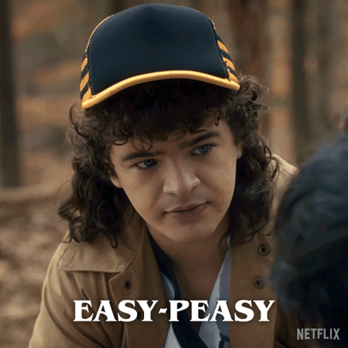Man With Curly Hair Wearing Hat Saying Easy Peasy GIF