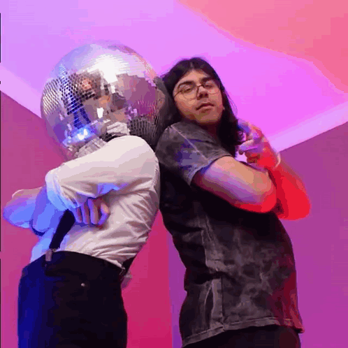 Man with Disco Ball Head Next to Microphone