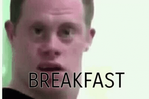 Man with Down Syndrome Making Funny Face Breakfast