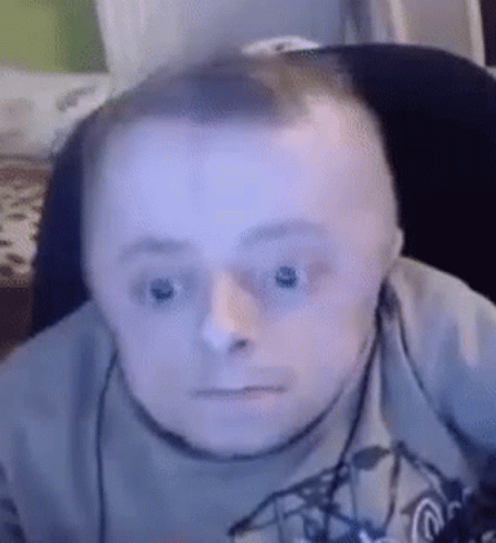 Man With Down Syndrome Wearing Headphones Making Funny Face