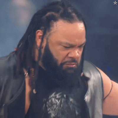 Man with Dreadlocks and Beard in Leather Vest