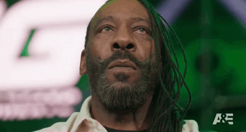 Man With Dreadlocks And Beard Looking Up Green Background GIF