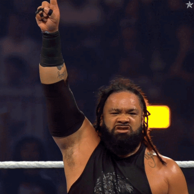 Man with Dreadlocks and Beard Pointing