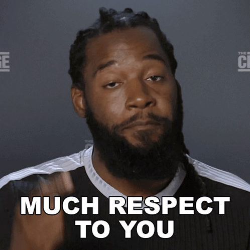 Man with Dreadlocks and Beard Saying Much Respect