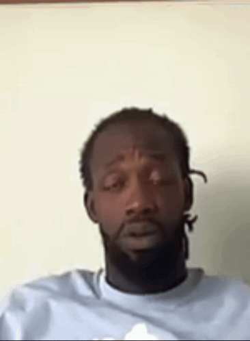 Man With Dreadlocks And Beard Sitting GIF