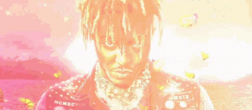 Man with Dreadlocks and Necklace in Pink Jacket