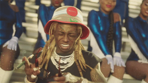 Man with Dreadlocks and Red Hat with Letter G