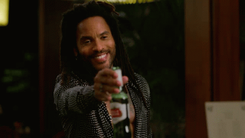 Man With Dreadlocks Holding Beer And Smiling GIF
