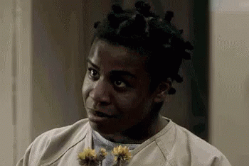 Man With Dreadlocks Holding Flowers and Funny Face