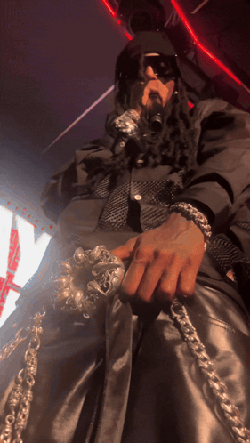 Man With Dreadlocks Holding Microphone Saying A