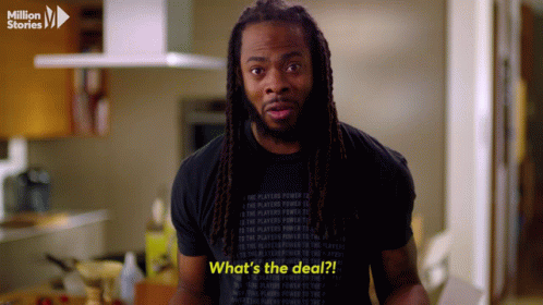 Man With Dreadlocks in Black Shirt Saying What's the Deal