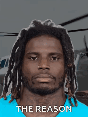 Man With Dreadlocks In Blue Shirt Saying The Reason GIF