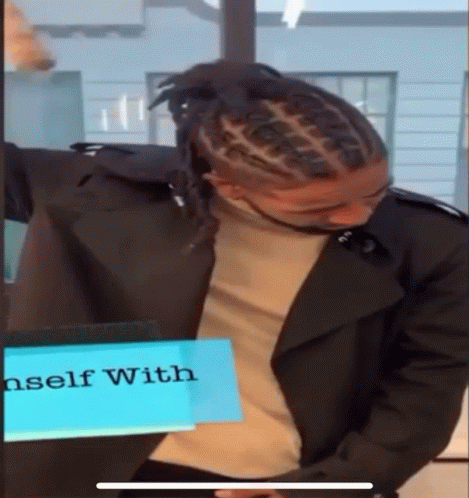 Man With Dreadlocks In Front Of Sign Saying Self With GIF