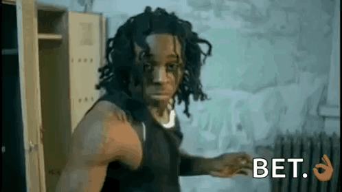 Man with Dreadlocks in Locker Room