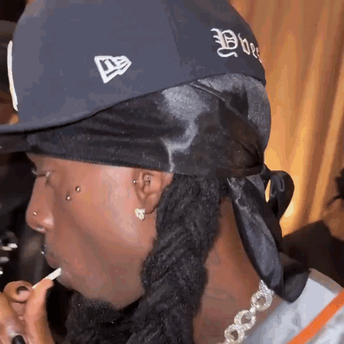 Man With Dreadlocks in New Era Hat