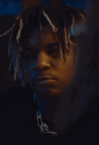 Man With Dreadlocks Looking at Camera