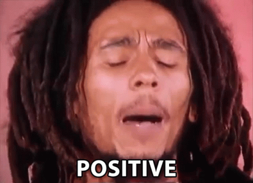 Man with Dreadlocks Making Face Positive