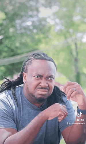 Man With Dreadlocks Making Funny Face GIF