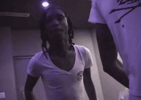 Man With Dreadlocks Making Peace Sign GIF