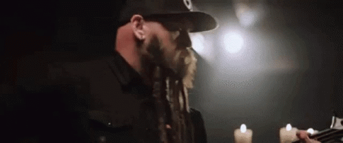 Man With Dreadlocks Playing Guitar GIF