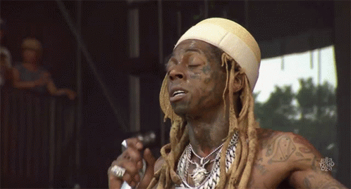 Man With Dreadlocks Singing Into Microphone