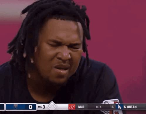 Man with Dreadlocks Watching Baseball