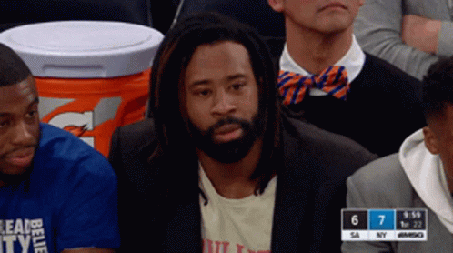 Man With Dreadlocks Watching Game in Stands
