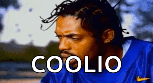Man with Dreadlocks Wearing Blue Nike Shirt