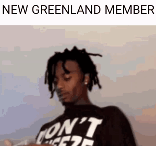 Man With Dreadlocks Wearing New Greenland Member Shirt GIF