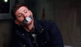 Man With Duct Tape On Mouth Wearing Tie And Jacket GIF