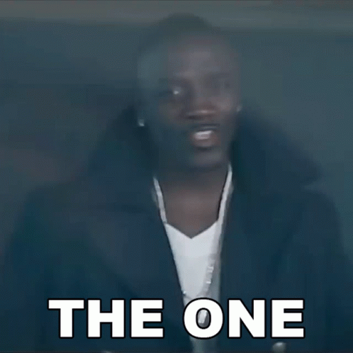 Man With Ear Buds and Jacket Says The One